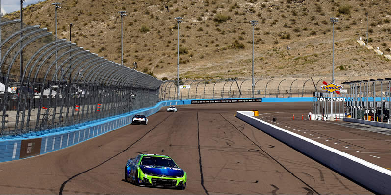 Kyle Busch drives during practice