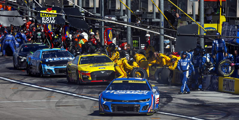 Kyle Larson exits pit road