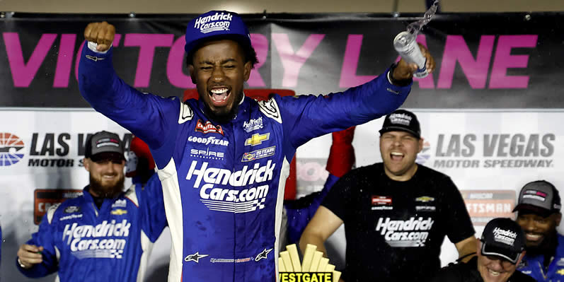 Rajah Caruth celebrates in victory lane