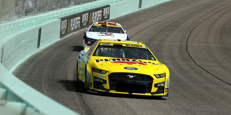 Ryan Blaney and William Byron drive during practice