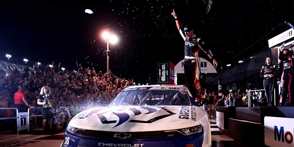 Ryan Sieg celebrates in victory lane after winning the Winn-Dixie 250