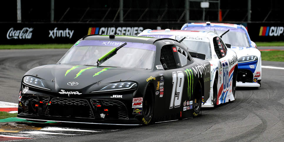 Ty Gibbs in the #19 Monster Energy Toyota leads Connor Zilisch in the #88 WeatherTech Chevrolet through a tight corner during the NASCAR Xfinity Series Chilango 150 in Mexico City