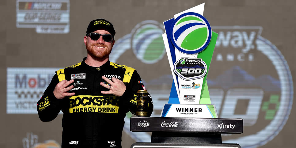 Tyler Reddick celebrates in victory lane after winning the Freeway Insurance 500