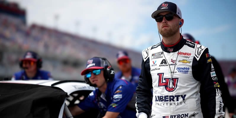 William Byron and crew walk the grid during practice