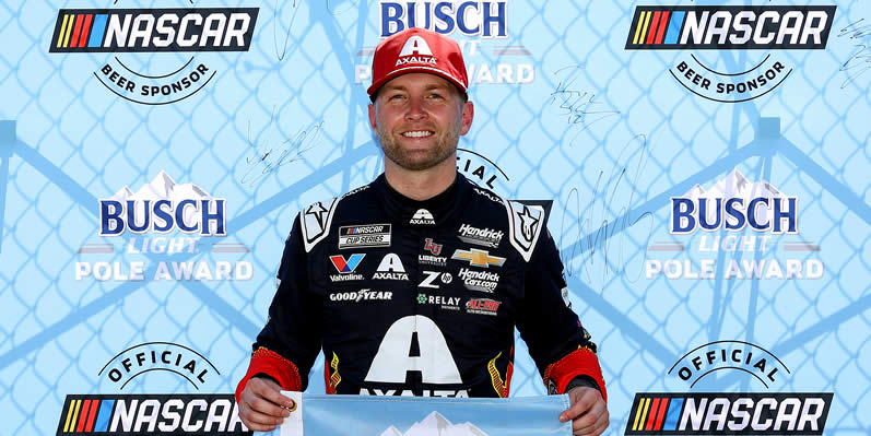 William Byron poses for photos after winning the pole award