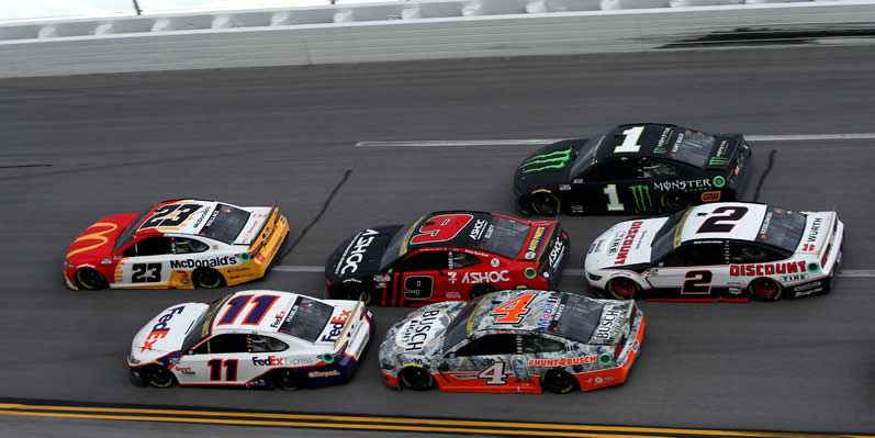 Bubba Wallace, Denny Hamlin lead a pack of cars