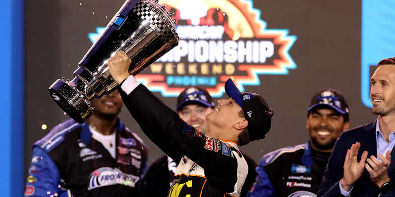 Zane Smith celebrates with the Championship trophy