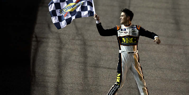 Zane Smith celebrates with the checkered flag